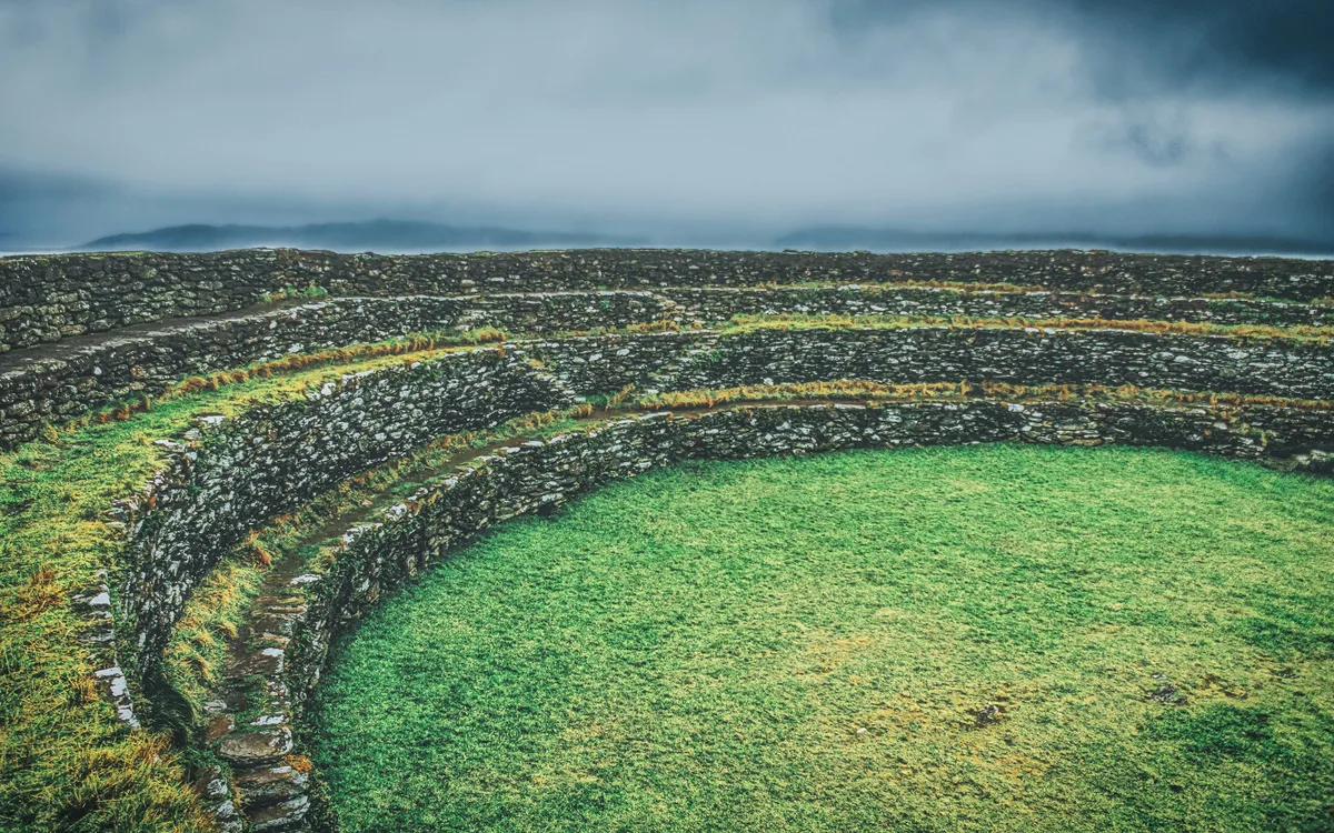 A vast landscape of green grass, symbolizing a clear path forward and solid grounding after closing the loop.